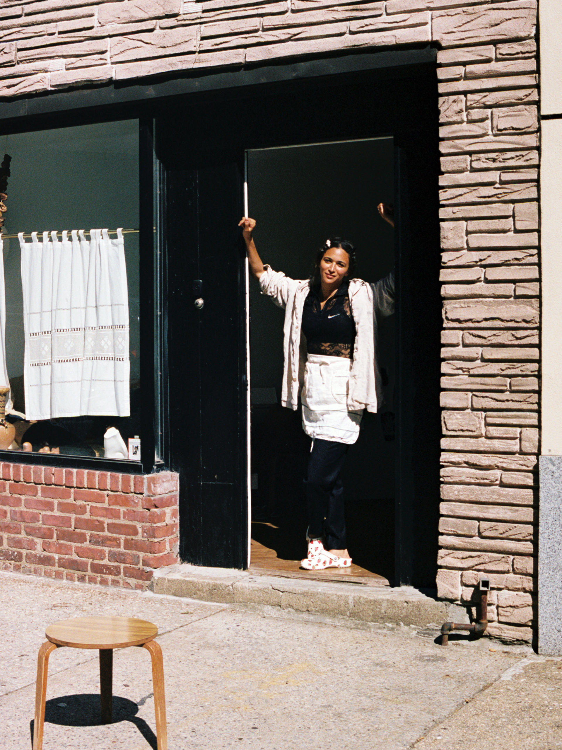 Laila Gohar stands in doorway