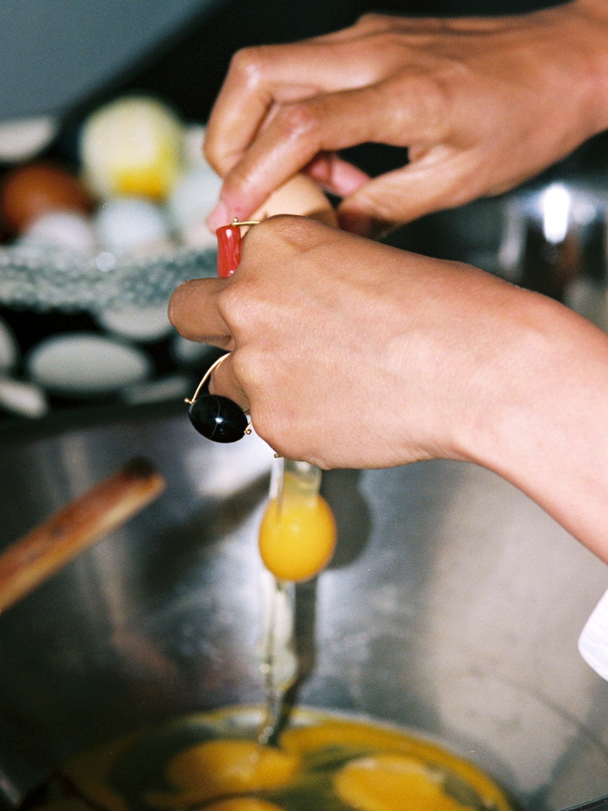 Cracking raw eggs in a bowl